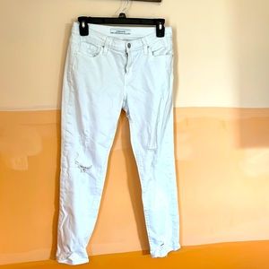 Distressed white jeans